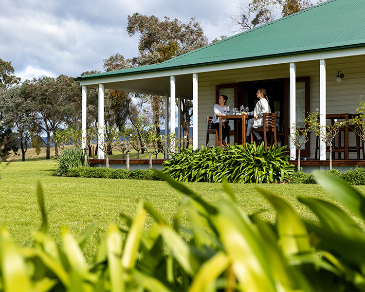 Guests sitting on the verandah enjoying a wine tasting at Scarborough Wine Co