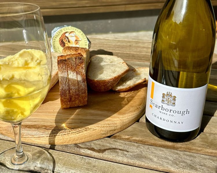 Glass of Scarborough Chardonnay with plate of bread