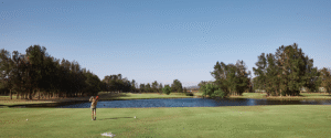 Golfer taking a swing on the course at Rydges Hunter Valley